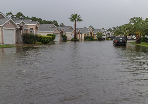 Residential street submerged in floodwater - www.mysoutherninsurance.com